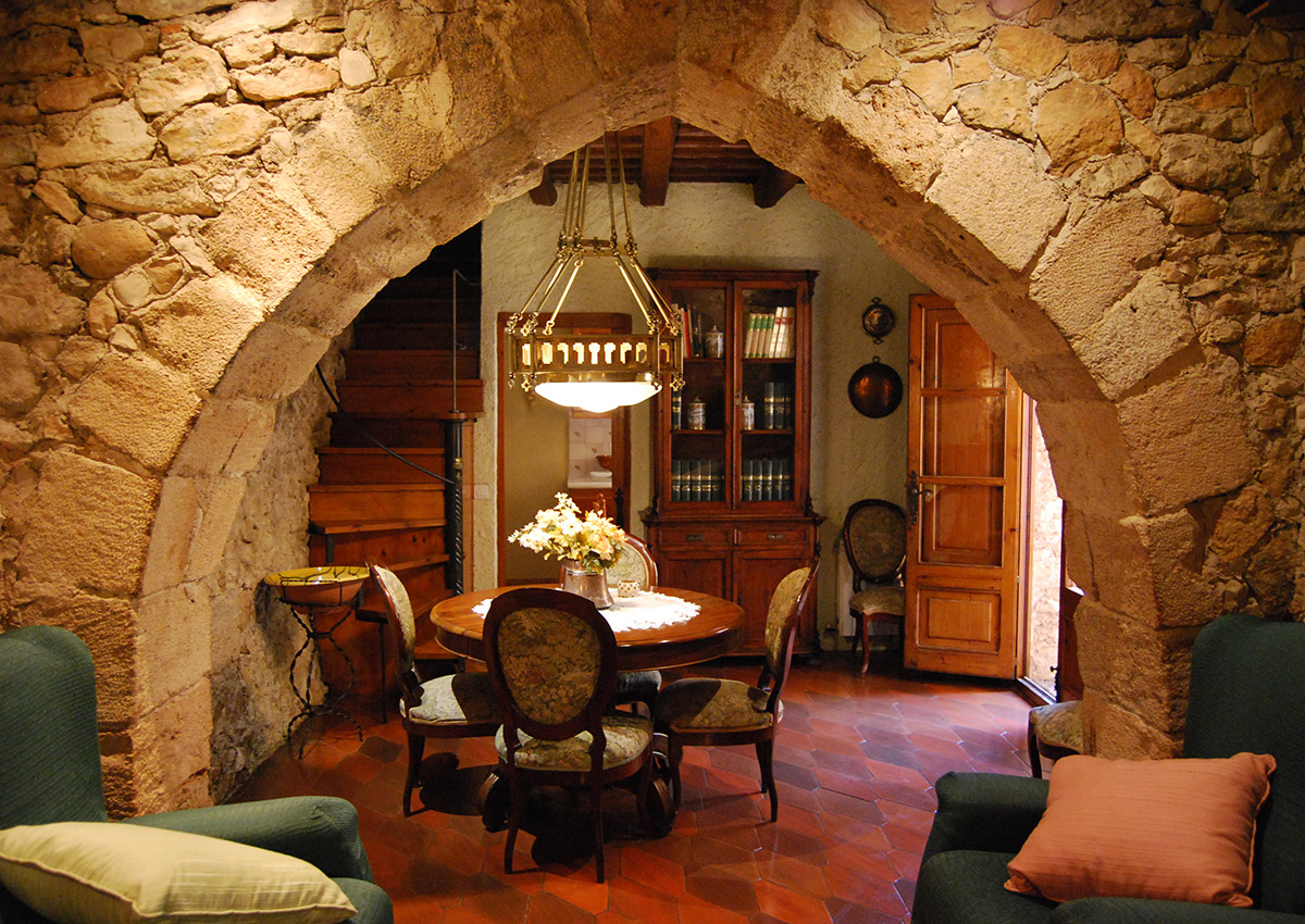 A modernist lamp accompanies the Elizabethan furniture of the dining room