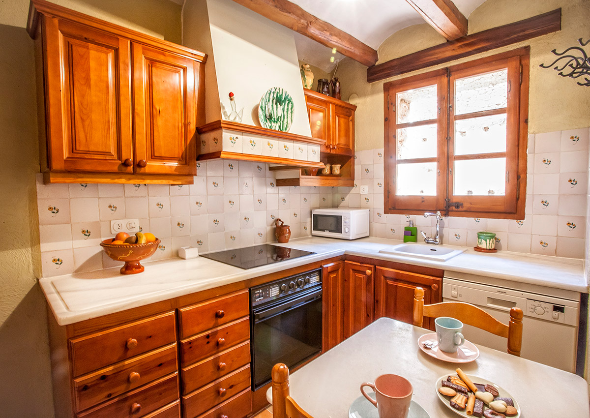 The kitchen has a dishwasher, ceramic hob, oven, microwave, fridge and freezer